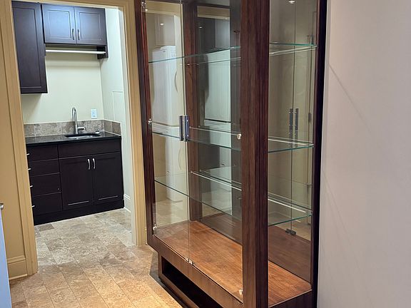 Left of entrance and laundry room