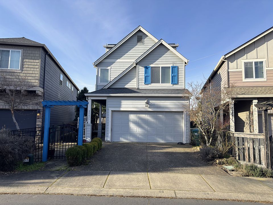 Clean, modern exterior with attached two-car garage.