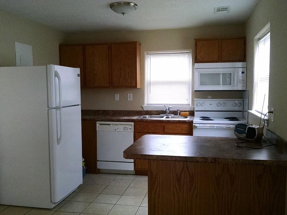 Kitchen with island to accommodate dining for two