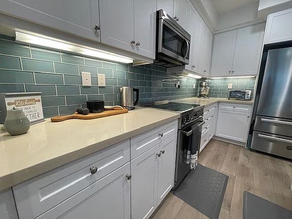 Elevated appliances, Baker's favorite electric mixer, toaster oven, electric kettle and extra storage,