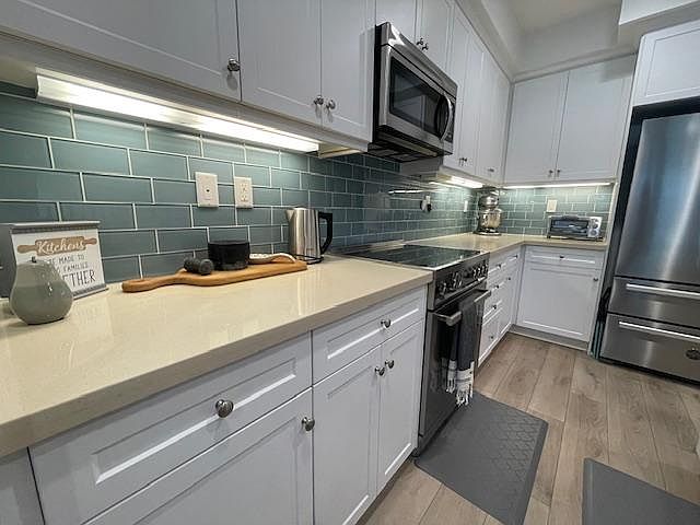 Elevated appliances, Baker's favorite electric mixer, toaster oven, electric kettle and extra storage,