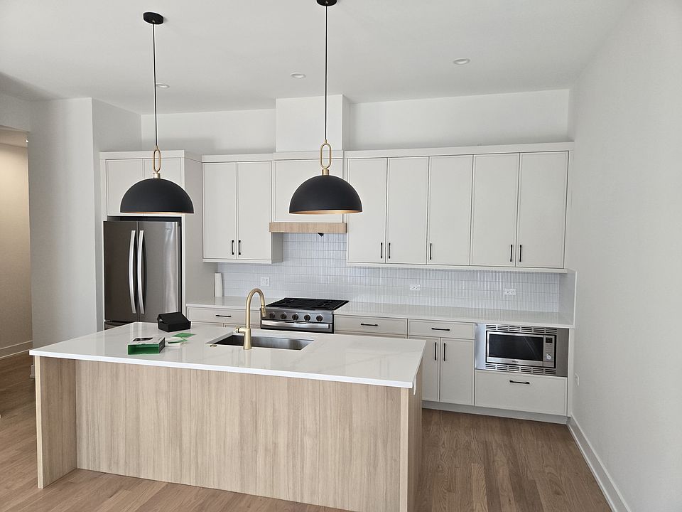 Gourmet Kitchen:
Island with dome lamps.
Modern shaker cabinetry with sophisticated styling
Gleaming quartz countertops with full backsplash
Stainless steel appliances package
Open concept design perfect for entertaining