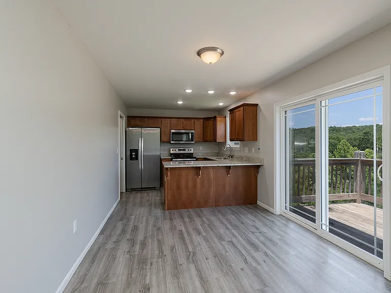 sliding door entrance to deck off of kitchen nook