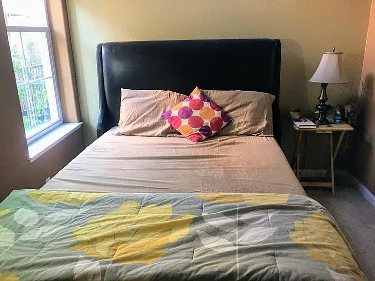 bedroom with high ceiling and lots of light