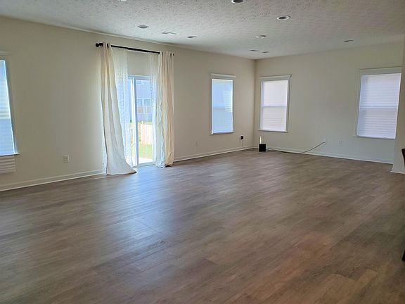 GREAT ROOM! lots of canned lighting and windows