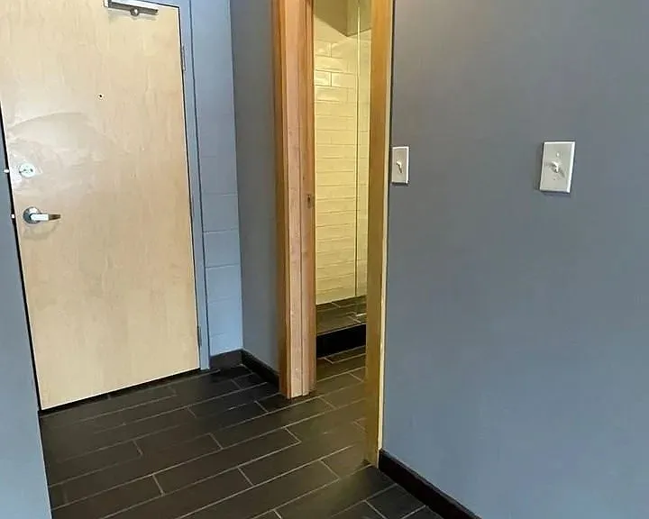 Step into modern living with LS Capital Group. This stylish entryway sets the tone for a comfortable, inviting home. Sleek finishes and spacious layouts await. Explore your future residence today and see what makes it unique!