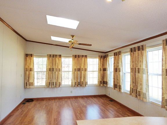 Family room open to the kitchen with numerous windows and sky lights to let in the natural light.