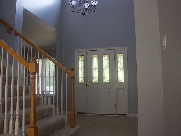 Front entrance by dining room and stairway to 2nd floor.