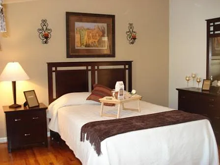 Bedrooms in our Littlefield Loop homes offer original hardwood flooring and space for a bed, nightstand and dresser. A separate area offer space for a small office space.