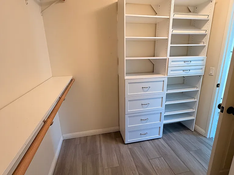 Primary walk-in closet.