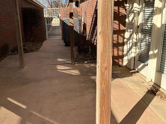 Side patio area with plenty of room for outdoor cooking.