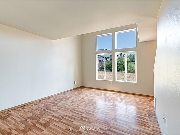 Light & bright throughout. Windows are currently foggy from failed gas seals and being fixed. Est completion mid-August.