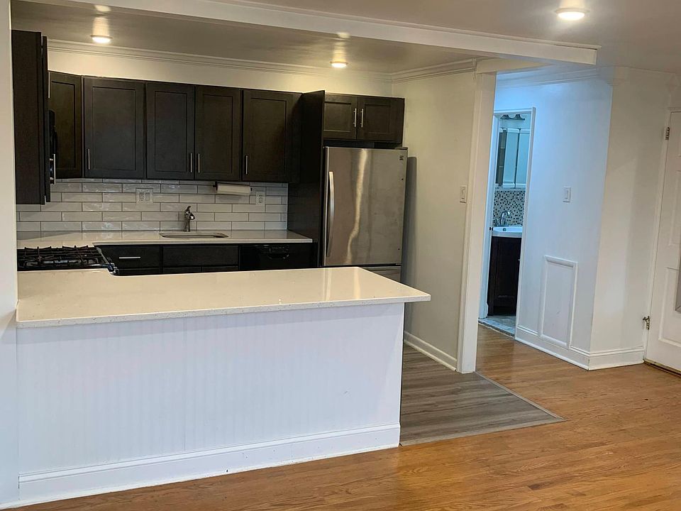kitchen with view of front door & bathroom