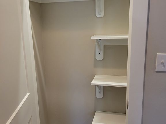 Entry closet with pantry shelves