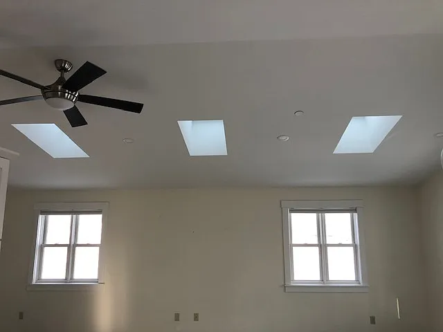 Living Area With Cathedral Ceilings, Skylites, Premium Laminate Flooring, Heat and Cooling Pump.