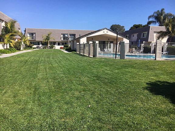 Park area and gated pool with spa and clubhouse