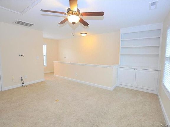 Custom built ins neutral bright colors - blinds on all windows for complete privacy