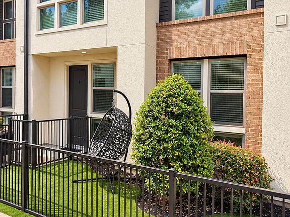 Modern townhome living with your own fenced turf yard.