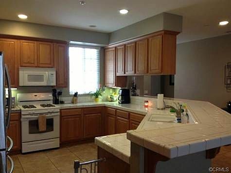 Open, well lit kitchen with lots of storage room!