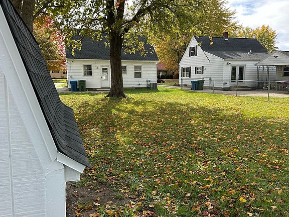 Fenced backyard of the home. Picture taken from near the shed
