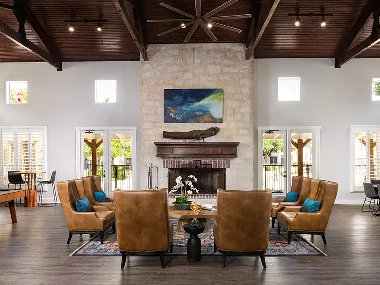 Great Room with striking fireplace and luxe seating