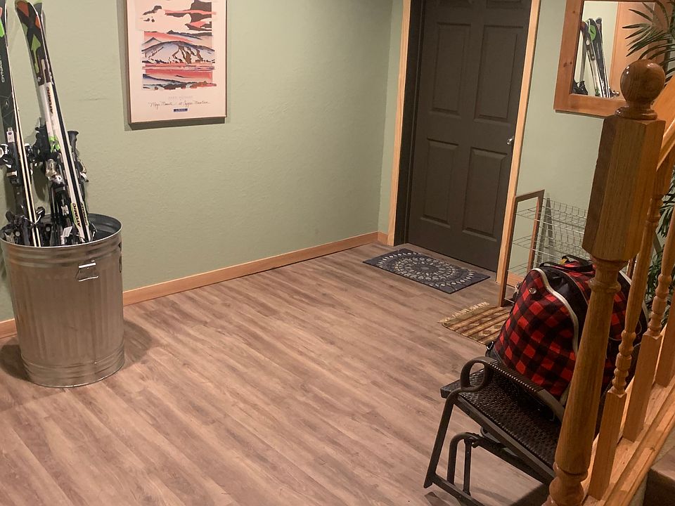 Dedicated entry and gear storage for skis, snowboards, boots, and outdoor equipment.