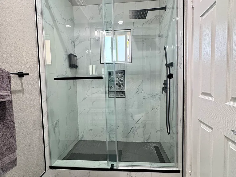 Remodeled bathroom featuring modern finishes and clean, updated design.