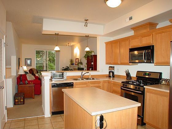 You'll enjoy the eating bar, island & abundant cabinetry