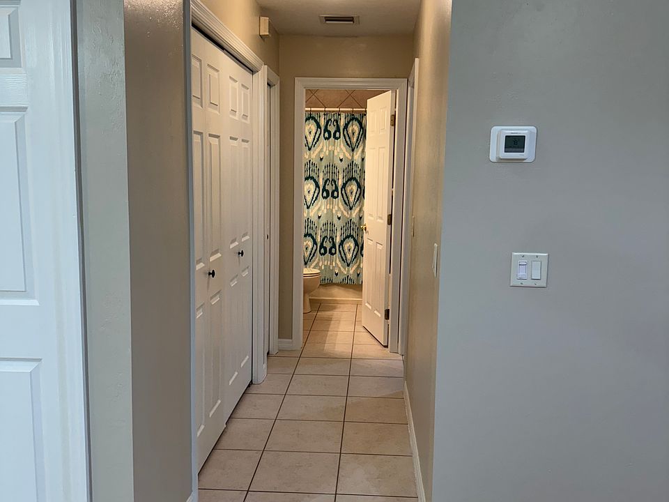 Hallway to spare bedroom and second bathroom