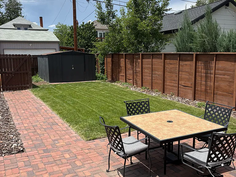 fully fenced back yard. dining table, chairs and patio furniture can stay if wanted. backyard is not shared.