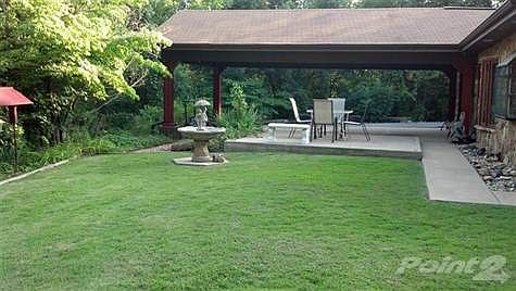 Front yard with view of large carport.