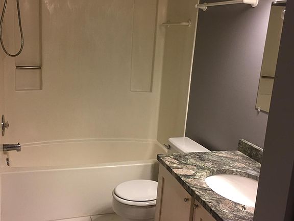 white-tiled floors, granite top vanity