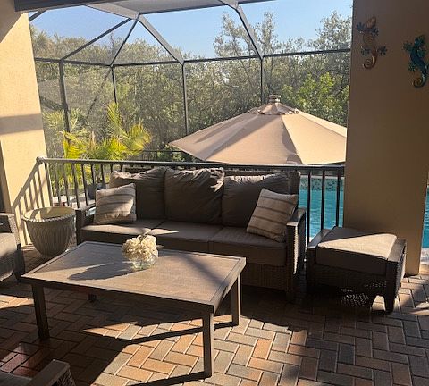 Covered back porch area above pool deck