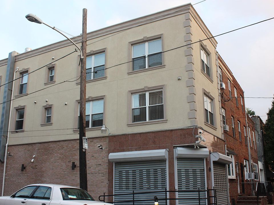 Front of the building. Commercial space on the bottom and the apartment is the top two floors.