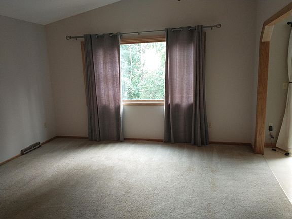 Upstairs living room, view #2. Large picture window to view trails out the vack