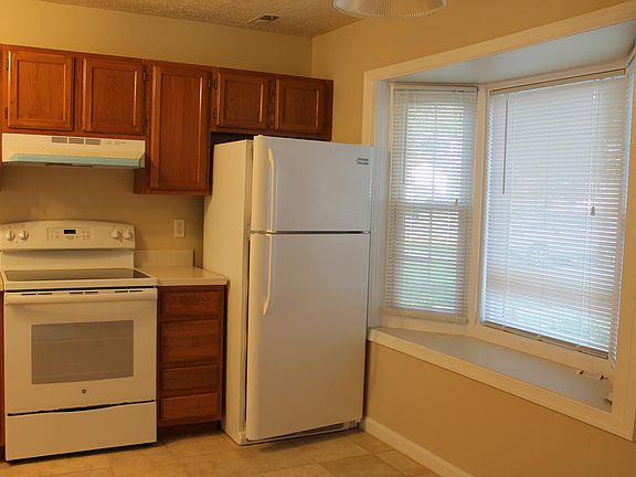 Kitchen with bay window and space for table and chairs.