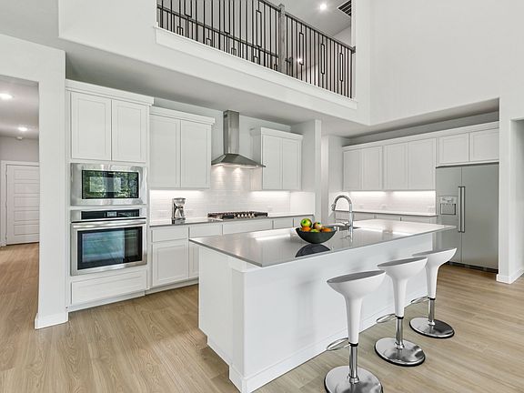 Kitchen in the Mercury home plan by Trophy Signature Homes - REPRESENTATIVE PHOTO