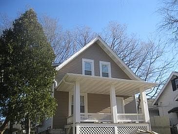 Front of house with inviting porch