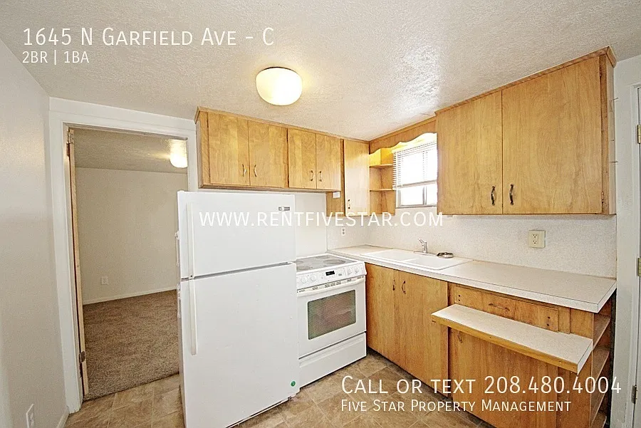 Spacious & Private 2 Bedroom, 1 Bathroom End-Unit Apartment with Garage, Shop & Patio! — Photo 4