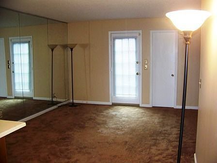 Living Room with Mirrored Feature Wall