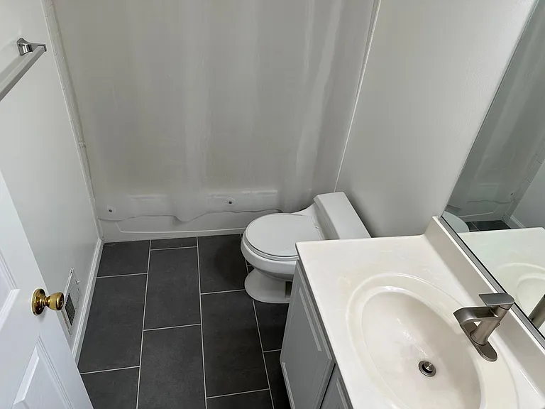 Upstairs hallway bathroom with lower toilet to better suit children