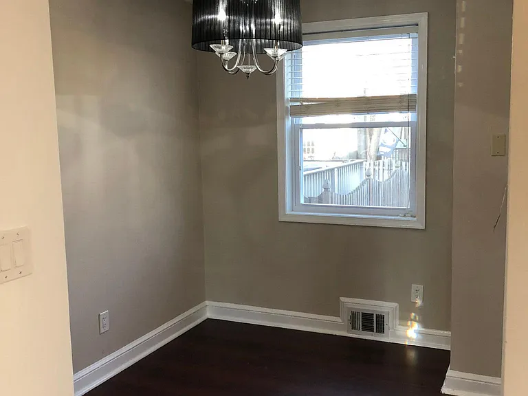 Dining Room with Black and crystal chandelier