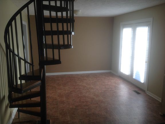 Spiral staircase to Upstairs