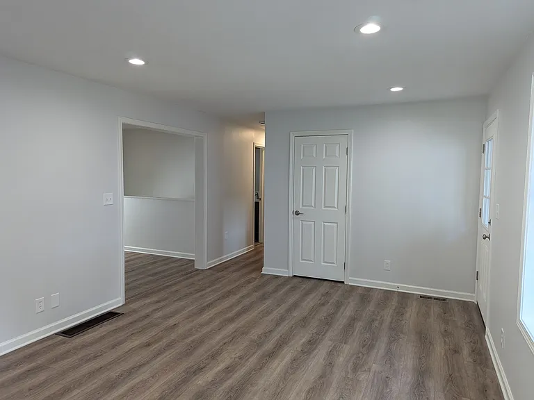Living Room View Towards Hallway and Dining Area