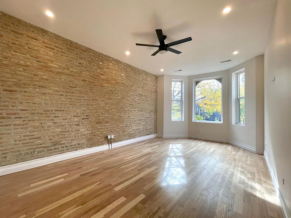 Living room looking out onto tree lined street