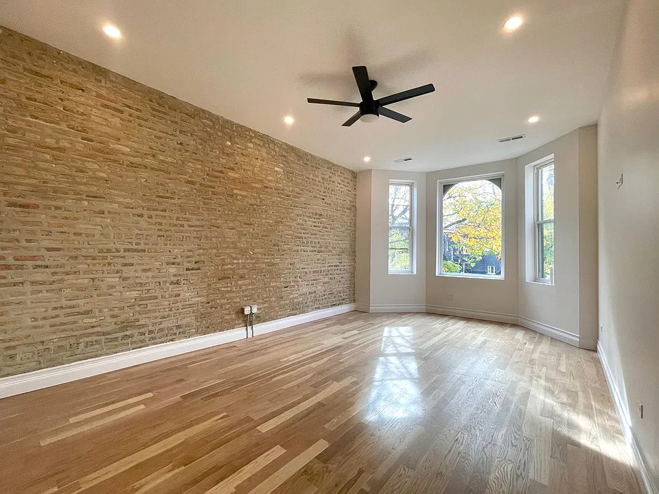 Living room looking out onto tree lined street