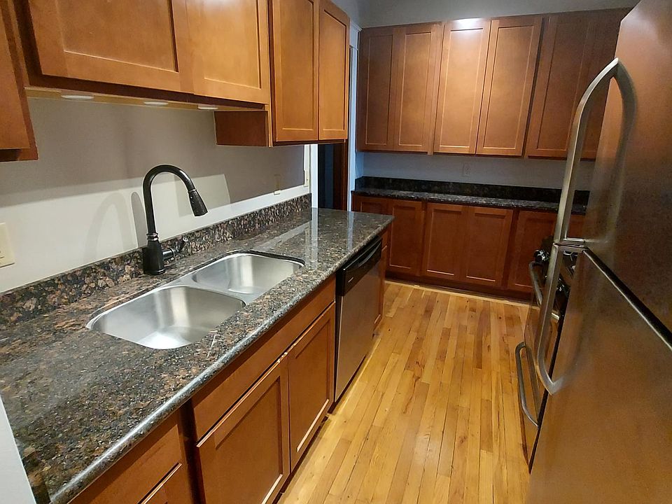 Kitchen features unique light feature, granite counters, stainless steel appliances, dishwasher, and updated maple cabinets.
