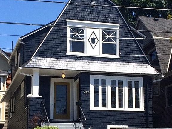 Original details intact in this 1900s Capitol Hill duplex home. The glass door that you see is the door to your apartment upstairs. The other door to the right is the door to the other apartment in the duplex.
