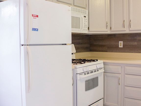 The kitchen features a brand new stove.