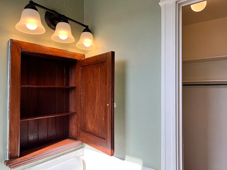 Original medicine cabinet and updated lighting in Apt. 405.